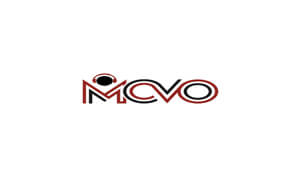 MCVO Logo In red and black text the letters "MCVO" are present in a white box. The M has a black circle with red headphones.