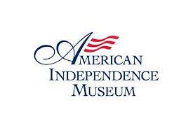 American Independence Museum written in dark blue with red waves attached to the A in American made to look like a flag.